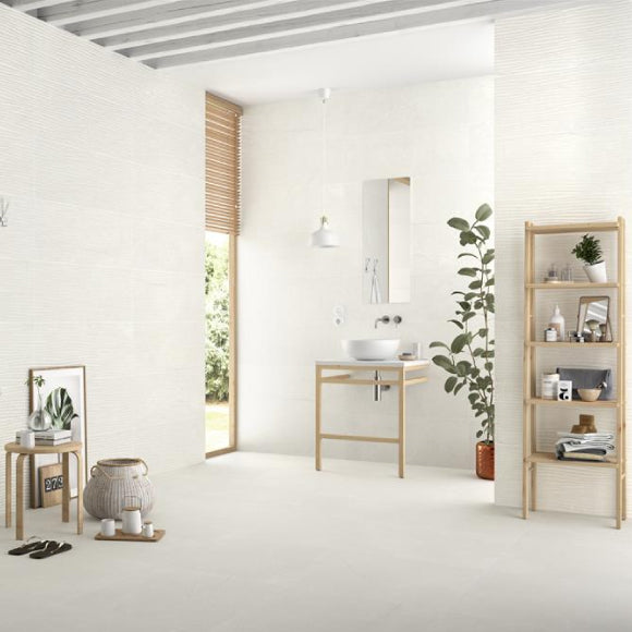 Beige tile on wall and floor of bathroom
